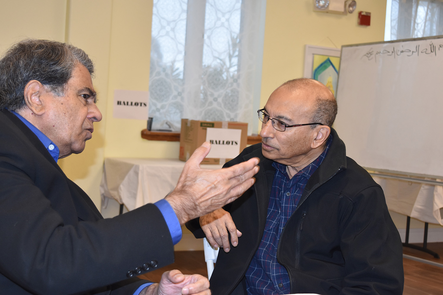 Syed Mahmood (left) talking to Rifai, former president of United Muslim of America